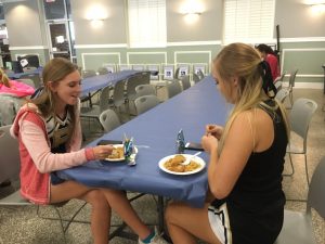 Olivia Brock, sophomore, and Ansley Spofford, sophomore, enjoy Chinese food at the gold card lunch.