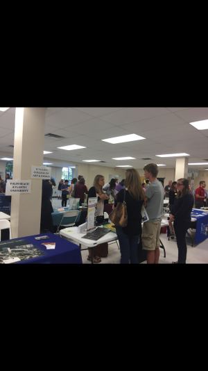 Students and parents gain information at the Ringling College of Art and Design table