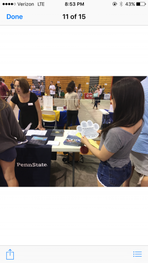 Isabella pittman, senior, reads about Penn State's requirements and information