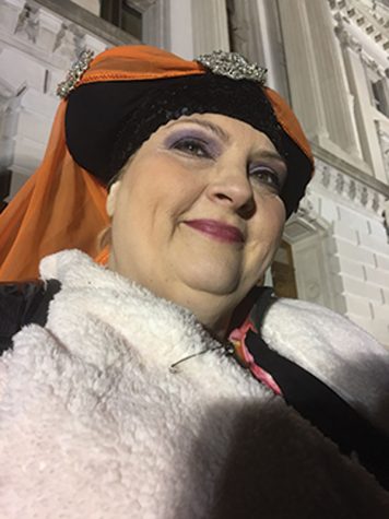 Trisha Fugelman wears a safety pin on her coat to represent that she is a safe person for those of minority populations to go to. Fugelman has been a member of The Sisters of Perpetual Indulgence, which is an organization that works to benefit marginalized communities.