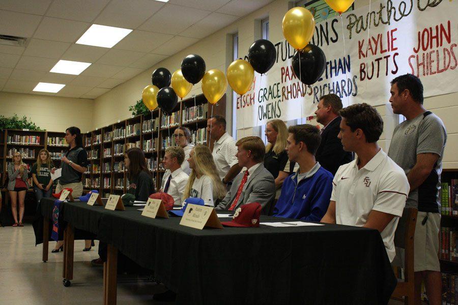 Six+senior+student+athletes+sign+letters+of+intent+to+confirm+their+commitment+to+college+teams.+After+years+of+training+they+will+continue+their+sport+at+a+collegiate+level.