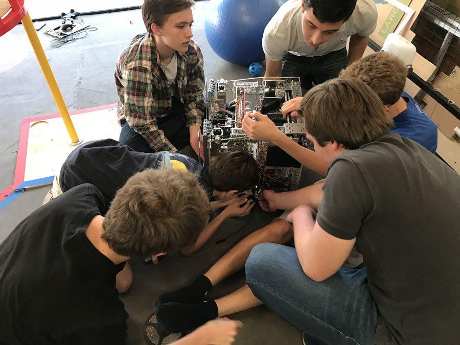 Members+of+the+KNO3+Robotics+Team+fix+work+on+their+robot+during+one+of+their+triweekly+practices.
