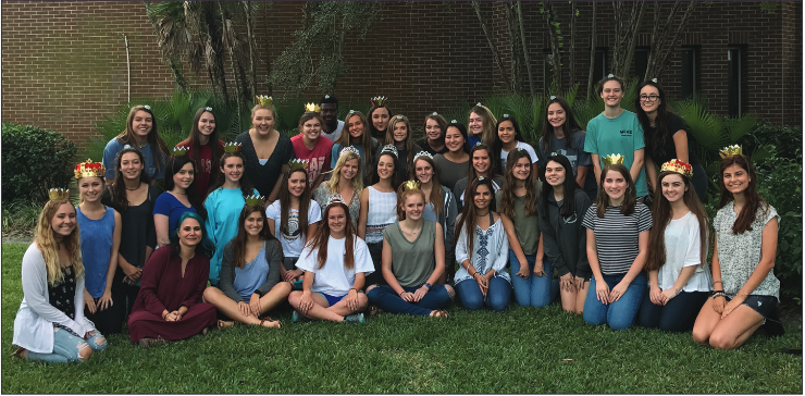 Celebrating their crown win, members of the yearbook staff gather for a staff party. Former yearbook advisor David Webb provided food for the school’s first crown win.