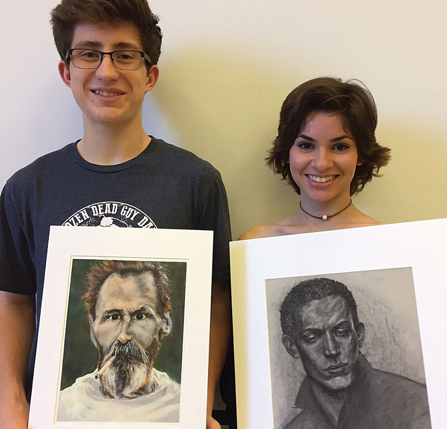 Silver Medal recipients, juniors Jack Glover and Elena Grant display their award winning work. Grant and Glover were of the top one percent of the 330,000 artworks submitted for the award.