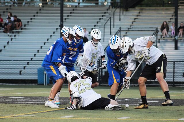 Plant and Jefferson players battle for the ball at a home lacrosse game against Jefferson high school on Mar. 20.