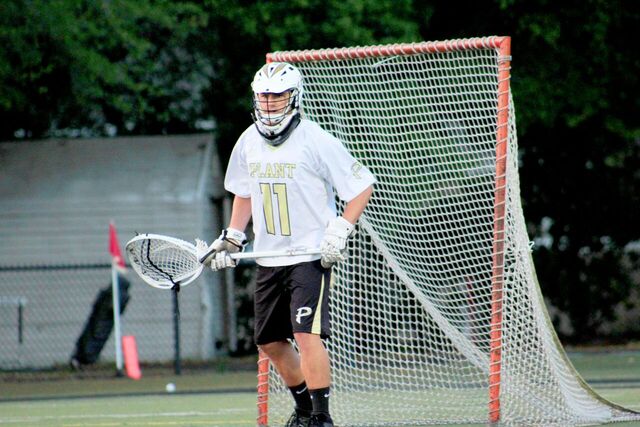 TJ Donahue stands at the goal ready to defend against Jefferson at a home lacrosse game against Jefferson high school on Mar. 20.