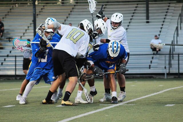 Plant players push against Jefferson to get the ball and score another goal at a home lacrosse game against Jefferson high school on Mar. 20.