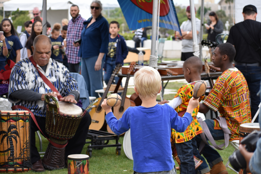 Bringing African culture to the Gasparilla Music Festival, Kuumba Dancers and Drummers brought a djembe and a djundjun for kids to play and learn about.  