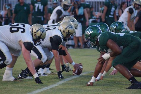 Varsity football ties defending state champions