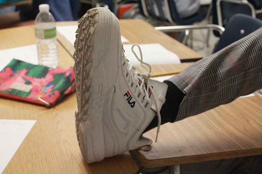 Flaunting his Fila Disruptors II, sophomore Cole Kempton expresses his inner dad. These sneakers have become a staple in the “dad sneaker” community. 