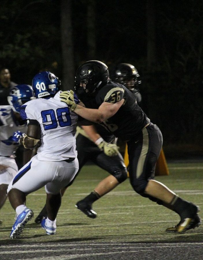 On the offense, senior offensive lineman Will Putnam pushes past an Armwood High School defensive end Sept. 7. Putnam finished two solo tackles against Armwood players on Dad’s Field. 