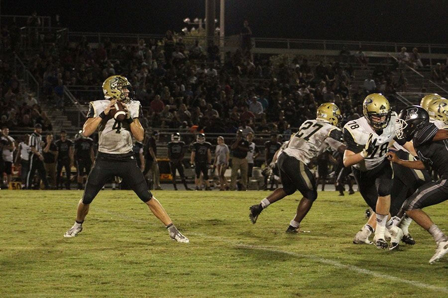 Junior Tucker Gleason prepares to pass the ball to an open receiver in the first half of the Plant vs. Robinson game Friday, Aug. 31. Moments after the play, the ball was caught for a first down at Robinson High School. 