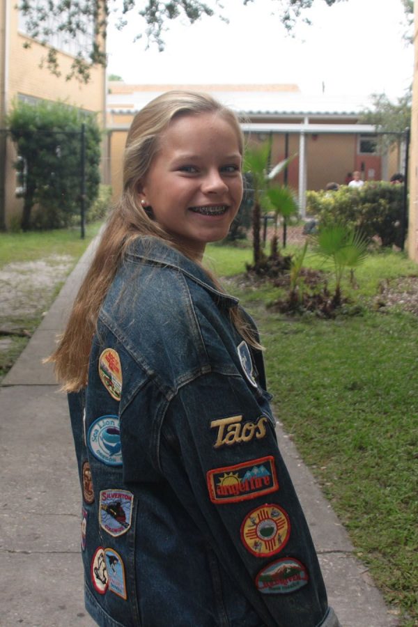 Modeling her jean jacket, sophomore Maggie Rowan says she enjoys shopping and looking for clothes. This “blast from the past” look was one of many students have been seen wearing this year. 