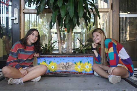 Students decorate the school with painted flower pots