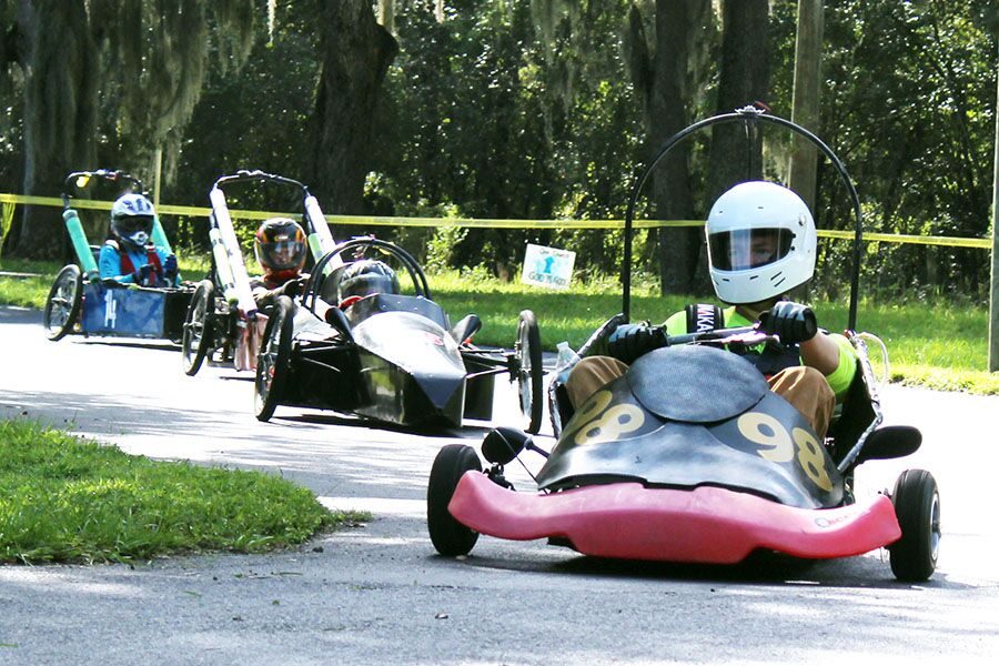 Speeding around the parking lot, senior Caleb Summitt races ahead of his competitors at Hillsborough Community College Brandon Sept. 22. As Summitt was driving, senior Luis Martinez delivered him certain instructions through a headset, such as whether a car was about to pass him or not.