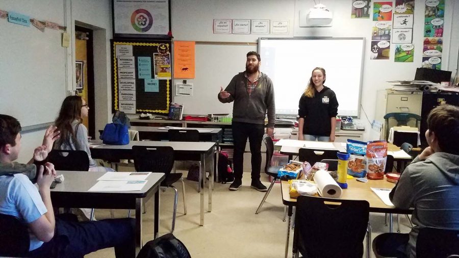 Standing in front of club members, guest speaker Daniel Nabatian discusses the importance of Jewish students connecting to their roots. The meeting revealed that Club Chai would be changing its name to the Jewish Student Union Jan. 16.