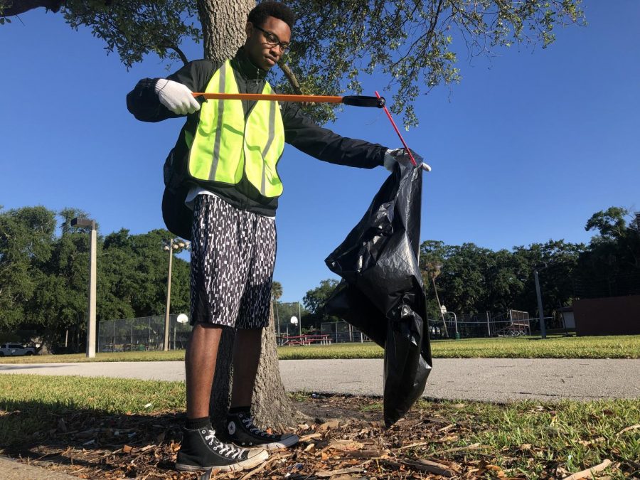 Cleaning up garbage near the water of Mckay Bay, senior Micah Smith picks up a straw and puts it in his trash bag at Desoto Park, Saturday April 27. This was Ecology Club’s fourth official cleanup of the school year. Spreading out to clean up Desoto Park, sophomores Shannon Adams and Julia Wolfe comb the ground for litter, while seniors Maddie White and Micah Smith sort garbage into trash and recycling bags Saturday, April 27. The cleanup was done in partnership with local organization Keep Tampa Bay Beautiful, that focuses on conservation, waste reduction and beautification of the Tampa Bay area. 