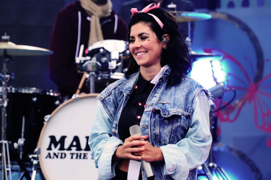 Diamandis performs at a live concert in 2012, during the middle of her Electra Heart era. Since the release of Electra Heart in 2012, Diamandis has released two more albums, titled Froot and Love + Fear.