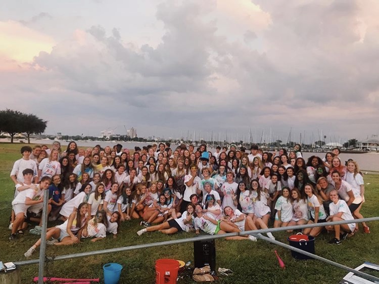 Members of South Tampa Young Life pose for a group photo after the color war, covered in different colored powder. Young Life is a national organization that promotes leadership and religion in middle and high schoolers.  