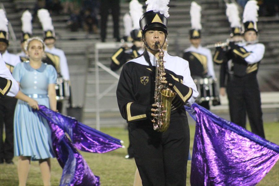 Instrument in front of her, junior Hannah Mongoy competes at Braden River High School with the rest of the marching band. Mongoy has been a part of the band program for the past three years. 