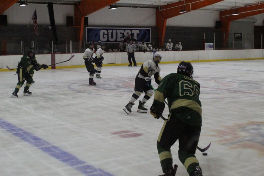 Leaning back, freshman Brenden Sickles moves parallel to an opponent. Sickles plays as a forward and scored his first official goal at the game against Mitchell.   