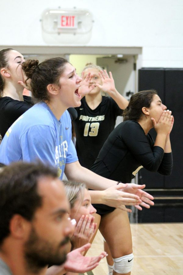 Reacting to the play, sophomores Sterling O’Neal and Mackenzie Nichols and juniors Erin Morrissey and Isabelle Medina celebrate after a score October 29 in the gym. The varsity volleyball team defeated Windermere High School 3-2.