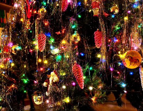 Artificial Christmas trees are easier to decorate than real trees because most trees are sold with lights pre-strung throughout the tree. This feature eliminates the hassle of stringing lights and guarantees that they will be evenly distributed throughout the branches. Photo courtesy of Wikimedia Commons.