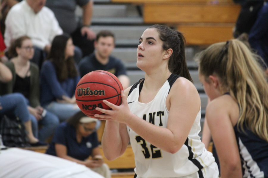 Gripping the ball, sophomore Silvia Farfante gets ready to shoot a free throw. Farfante said she loves the competition that comes along with basketball and is excited for future games against other challenging teams.