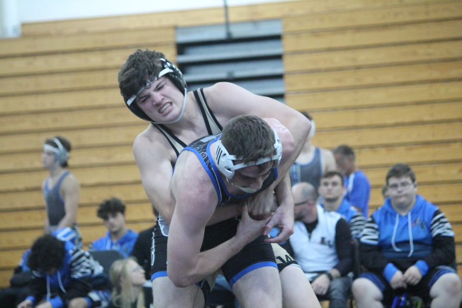 Trying to pin wrestler, sophomore John Prudhoe attempts to bring opponent to the ground. Prudhoe is excited for the rest of the season and hopes that the team gets to regionals. 