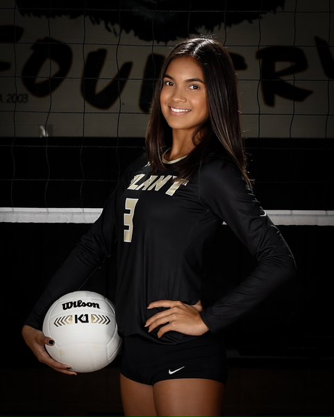 Holding the ball sophomore Isabella Gonzalez poses for the team photo. Isabella has been on the JV Volleyball team for two years and is an outside hitter. 