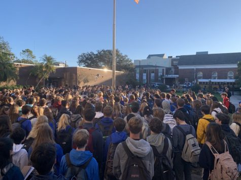 Gathered around the flagpole, students and faculty alike come together in prayer to mourn the loss of Carlos Medina. Medina died Monday, Jan. 20 after being in critical condition following a car accident. Medina was a junior and was on the Plant swim team.  