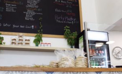 Displaying the vegetarian menu, a blackboard resides over the front counter in the Mediterranean Chickpea. Decorated by blue and white motifs, the Mediterranean feel of the restaurant felt atypical to a spot mostly dedicated to takeout.