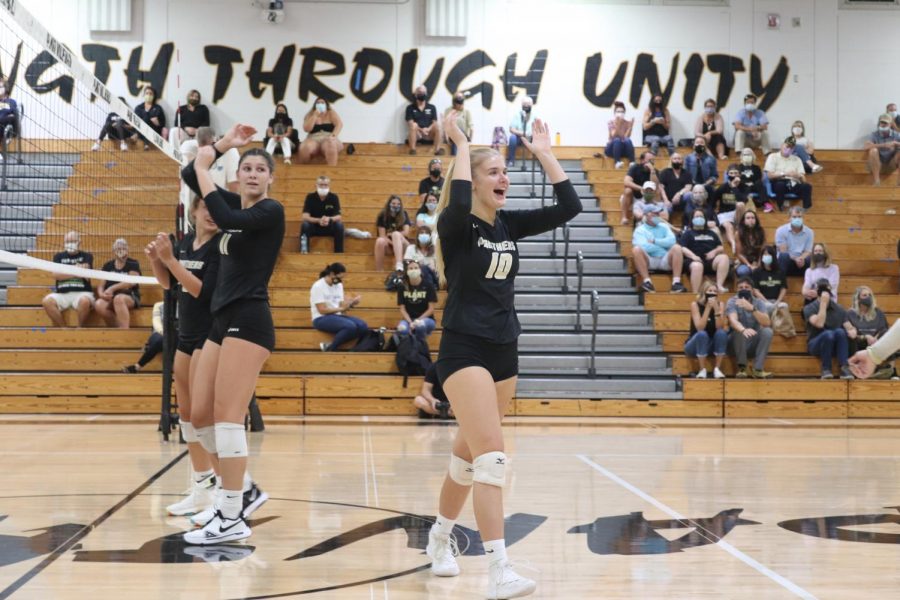 Lifting up her arms, sophomore Jade Bedell celebrates while playing Steinbrenner High School on Tuesday, Sept. 22. The team advanced to the State Semifinals after defeating Vero Beach High School.