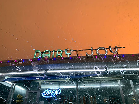 The electric Dairy Joy sign lights up during a summer storm last June. Dairy Joy is one of numerous great places to get ice cream in South Tampa. 