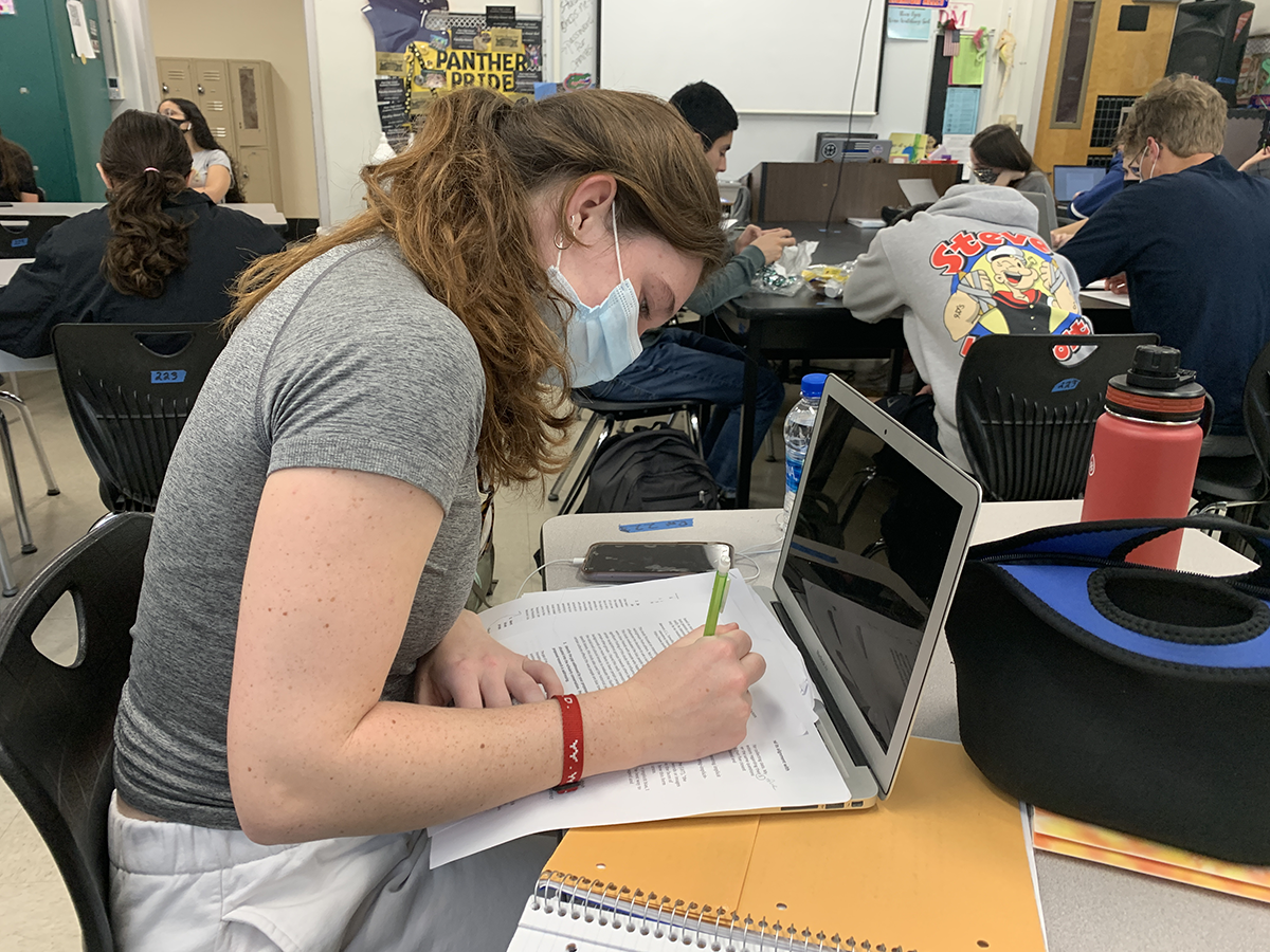 Studying at her table, junior Pearson Heim reviews her notes for her AP Environmental Science test. Juniors and seniors share their opinions on the AP classes offered at Plant.