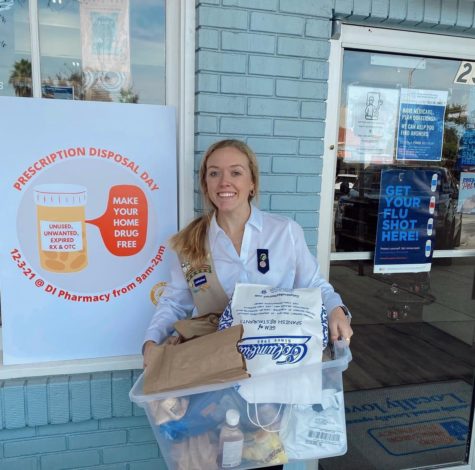 Holding medicine collected on her drug disposal day, Tatum Morris smiles. She collected 25 pounds of prescription and over the counter drugs for her Girl Scout Gold Award project.  