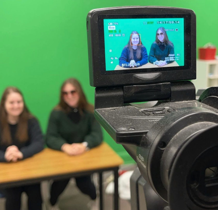 TV+Production+members+and+seniors+Hannah+Hurd+and+Delaney+Davis+record+the+morning+show.+TV+Production+is+currently+working+on+the+senior+video.++