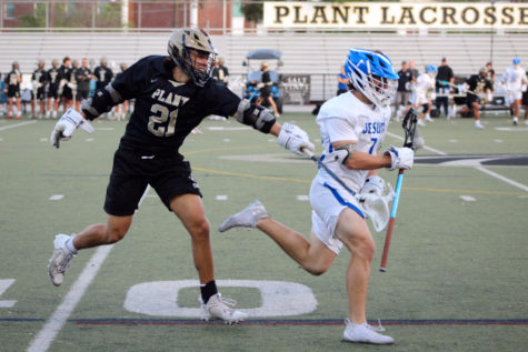 Junior Turner Ashby chases down his opponent in hopes of causing a turnover for his team. Ashby plays a significant role regarding Plant’s winning record and has recently committed to the Air Force Academy to continue his lacrosse career. 