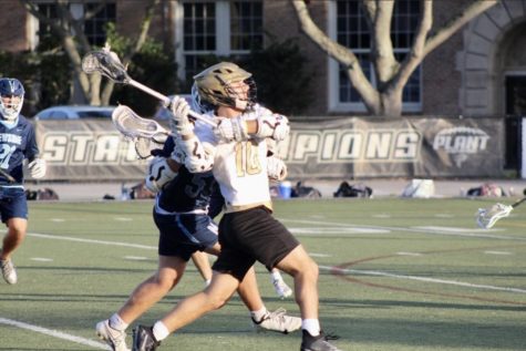 Stick in hand, senior Hayden Stoltzfoos prepares to make a goal. Stoltzfoos has played Plant lacrosse all 4 years and is now team captain.
