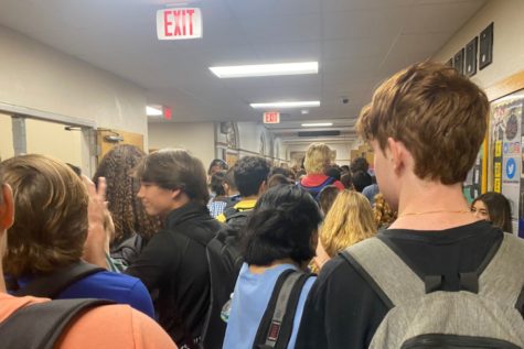 Crowding the hallway, Plant students squeeze tight while walking to their next class. Plant is experiencing a record student population this school year, and students say the hallways feel more cramped than ever. 