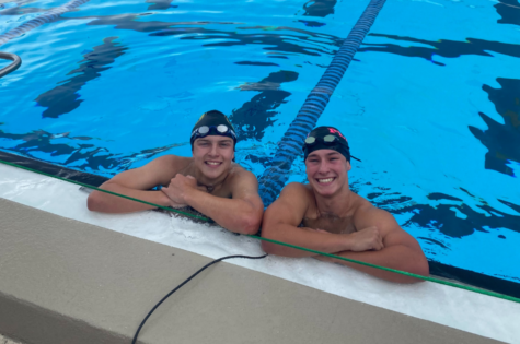 Seniors Hyatt Criser and Jack Bricklemeyer smile as they finish time trials for the last time.