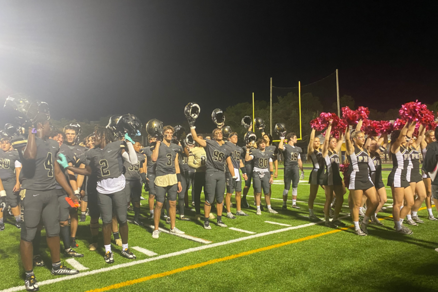 The Varsity football team and the Plant Cheer team celebrate after a 17-0 victory over the Strawberry Crest Chargers. 
