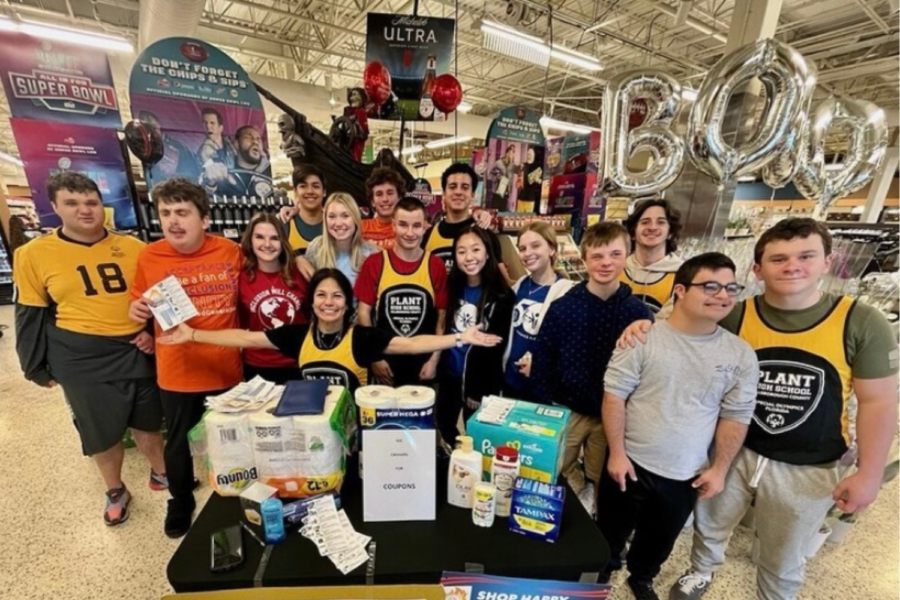 The Special Olympics club posed for a photo at their Publix Awareness Event. The club raised money through donations from shoppers walking by. 