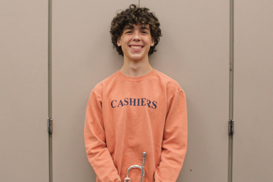 Holding his trumpet, Pierce White poses with a smile. After lots of hard work, White proves himself worthy of multiple far-reach leadership positions, such as Beta Executive President and Trumpet Section Leader.  
