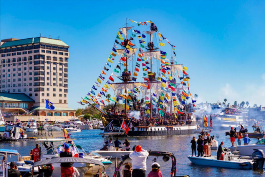Groups of people dress up as pirates on the José Gaspar ship for the Gasparilla Festival. 