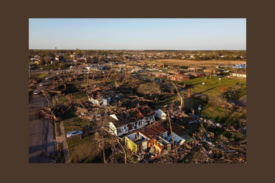 This is a single photo that displays such damage. Debris and wood are scattered, houses are demolished, and furniture is sprawled everywhere.  