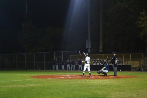 Senior, Hammy Lee, prepares to swing at the second home game of the season. The game remained tied until the third, and Plant eventually won. 