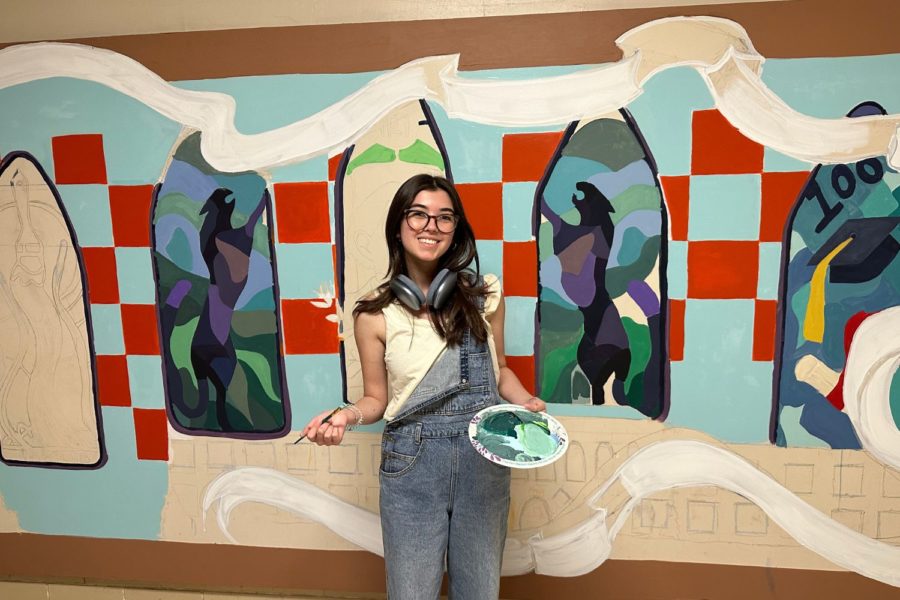 Smiling in front of the newest colorful addition to south hall, Sydney Nichols shares about the message behind this work of art. As the co-president of the PHS Artist and Writers Society, she has worked daily on making the mural happen. 