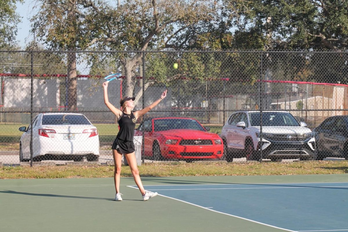  Getting ready to serve, Sophomore Brinley Vanaelst focuses on the ball. Vanaelst won her match against Leto 6-1.  