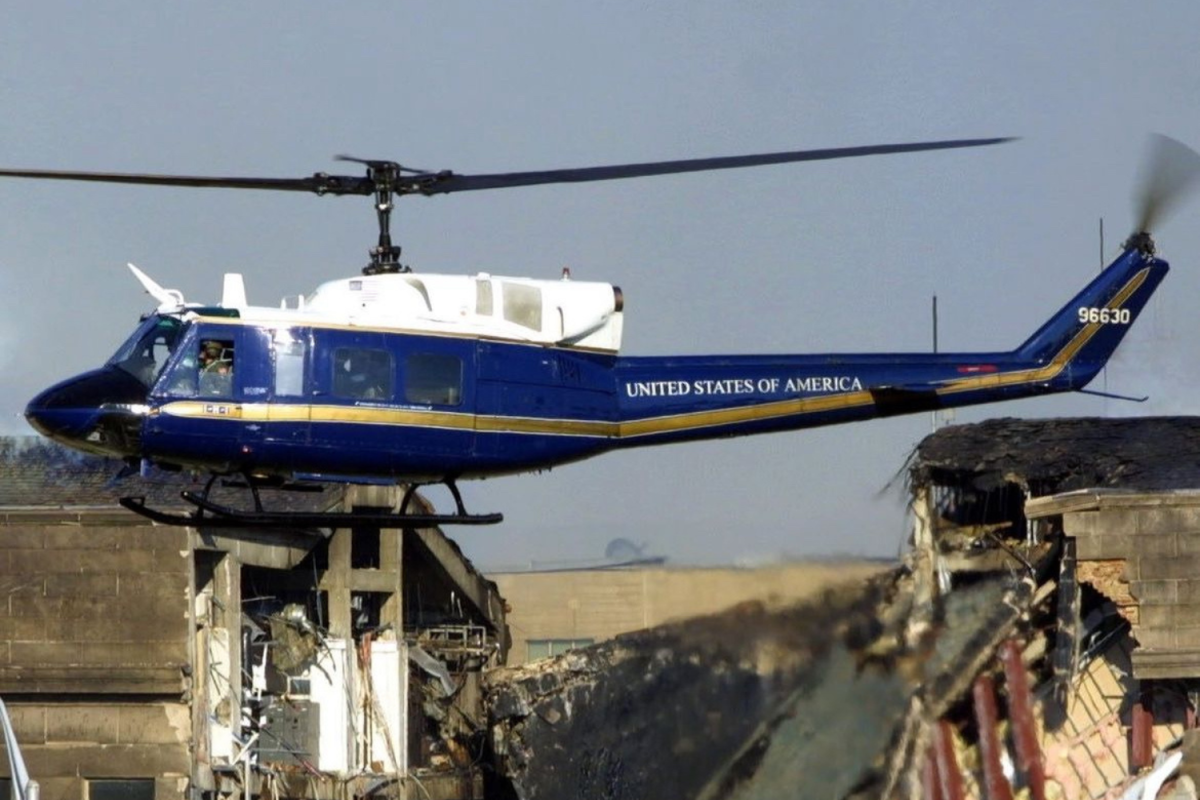 A United States of America Helicopter, hovers over a collapsed building after the terrorist attacks of 9/11. New York Times posted this picture in remembrance of the tragic events that occurred 23 years ago.  